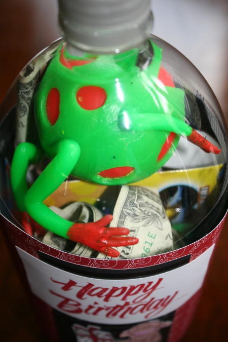 plastic frog in 2 liter gift bottle