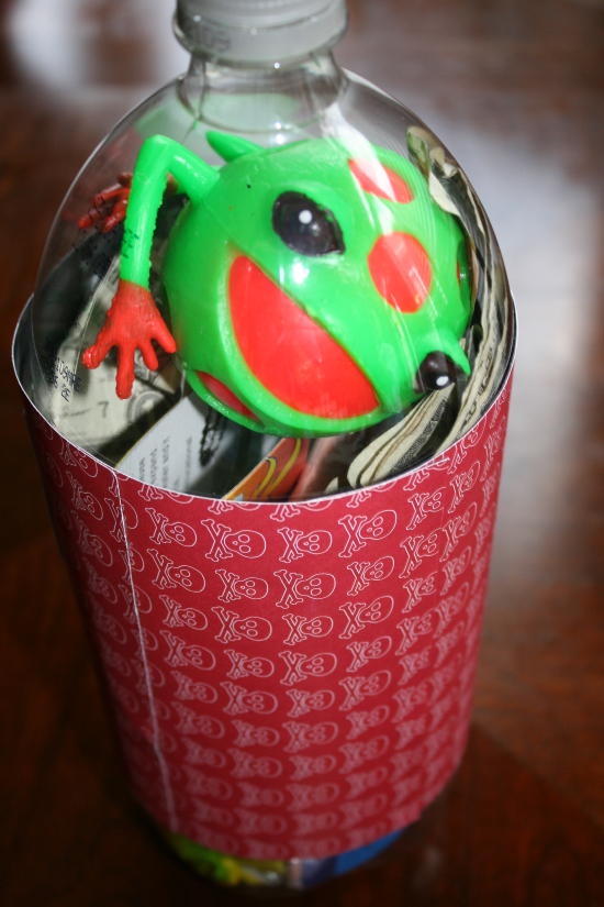 plastic frog and money in 2 liter gift bottle
