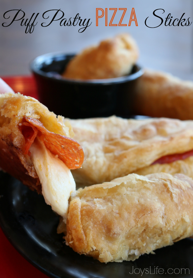 Golden puff pastry pizza sticks with melted cheese and pepperoni, fresh from the oven and ready to dip in marinara. It's flaky, cheesy, and perfect for sharing.