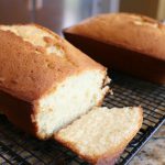 Classic vanilla pound cake loaf sliced on a cooling rack showing soft buttery crumb texture joyslife.com