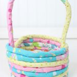 Handmade rope and fabric Easter basket in pastel colors, made with hot glue and cotton cord, perfect for DIY spring decor or personalized Easter gifts.