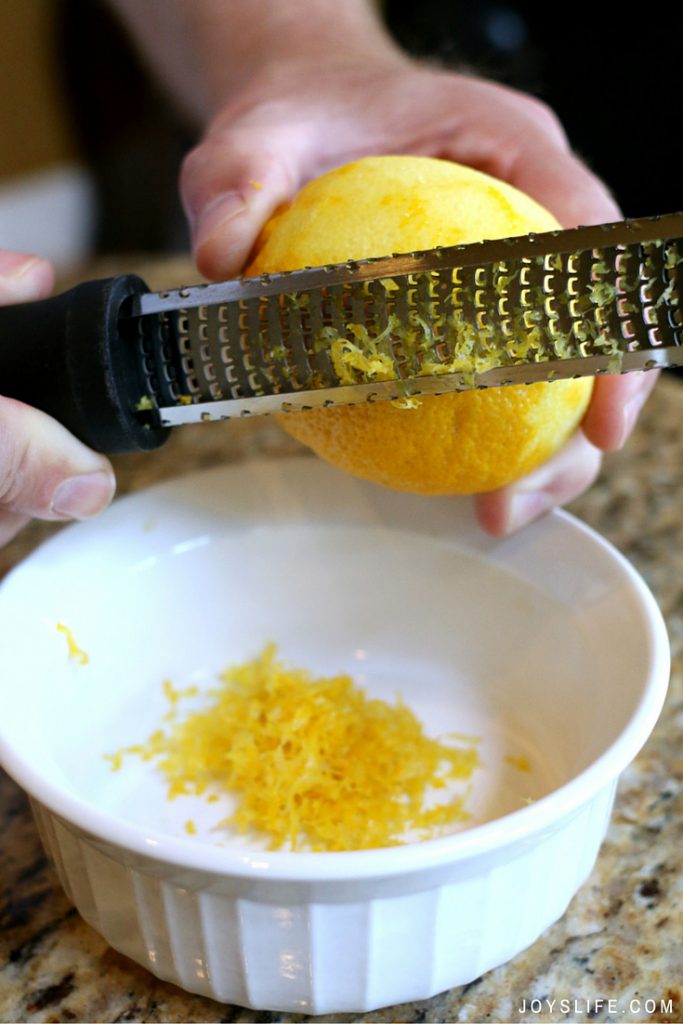 zesting a lemon with microplane for dessert recipe joyslife.com