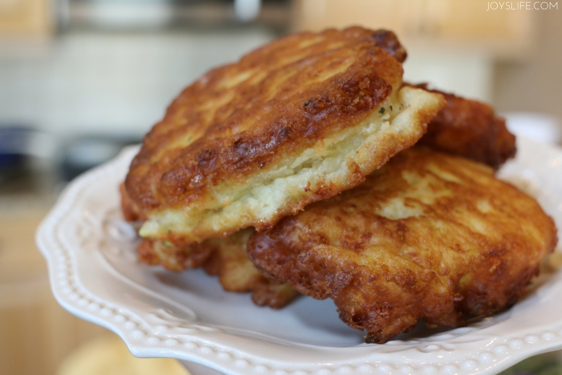 fried zucchini fritters white plate