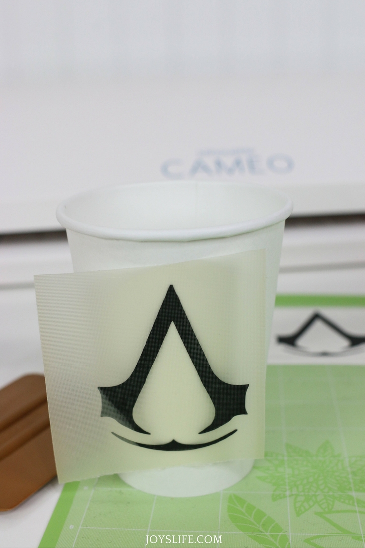 Assassin’s Creed black vinyl symbol applied with transfer tape