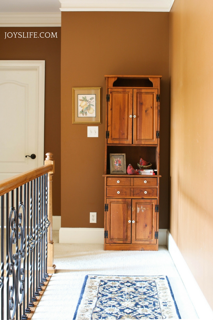 hallway before paint and hutch makeover