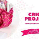 Pink fabric organizer with Cricut tools and a Cricut scraper tool on a white background, next to a Joy’s Life banner reading Cricut Projects, Ideas & How-Tos.