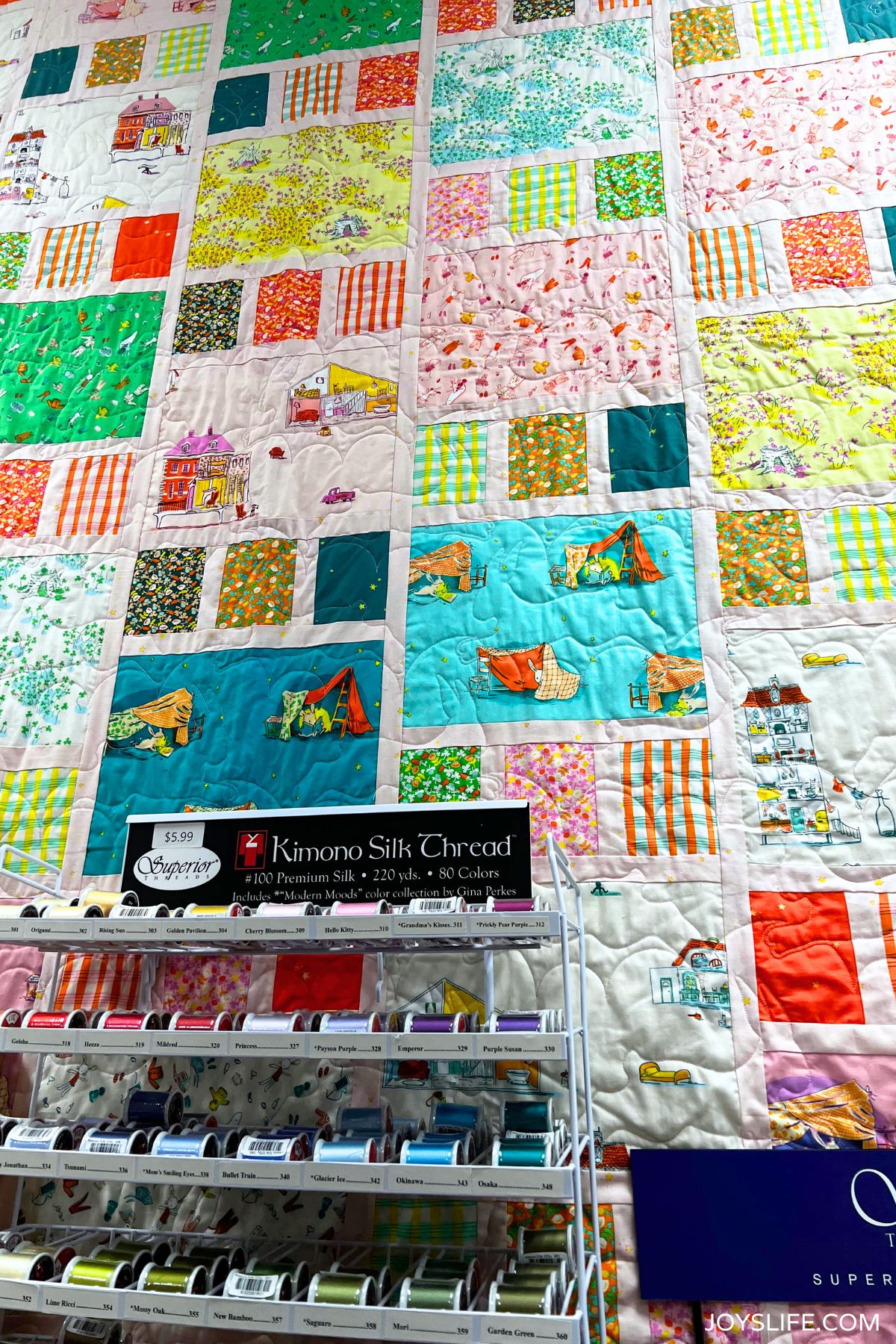 Kimono Silk Thread display with colorful quilt background at Bernina of Naperville quilt shop.