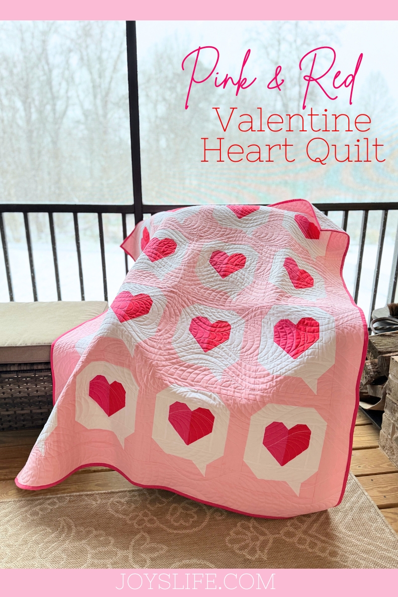 pink and red Valentine heart quilt draped over chair joyslife.com