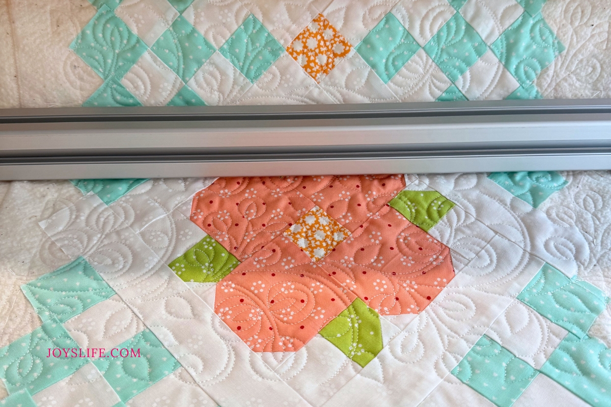 Pastel flower table runner quilted on a Bernina Q24 longarm machine on a frame, by Joy at JoysLife.com